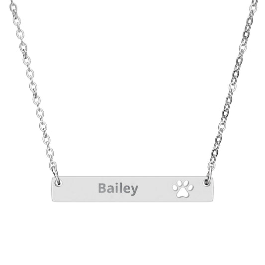 The Paw Print Necklace in stainless steel - engraved bar pendant with cutout paw detail
